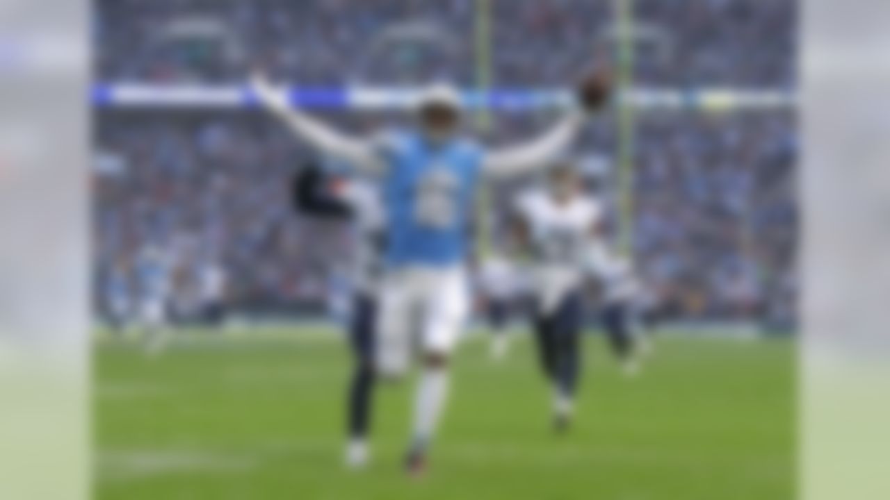 Los Angeles Chargers wide receiver Tyrell Williams (16) celebrates as he scores a touchdown during the first half of an NFL football game against Tennessee Titans at Wembley stadium in London, Sunday, Oct. 21, 2018. (AP Photo/Matt Dunham)