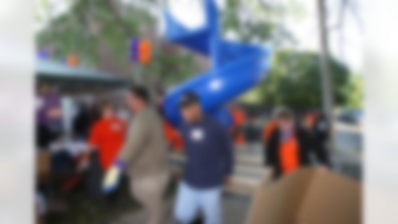 The Home Depot associates and KaBOOM! volunteers carrying one of the playground parts. (Photo by Tom Copeland/Home Depot)