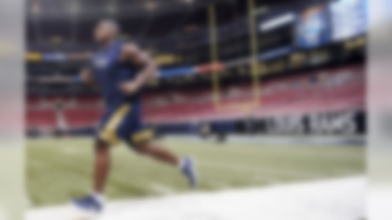 St. Louis Rams defensive end Michael Sam warms up before a preseason NFL football game against the New Orleans Saints, Friday, Aug. 8, 2014, in St. Louis. (AP Photo/L.G. Patterson)