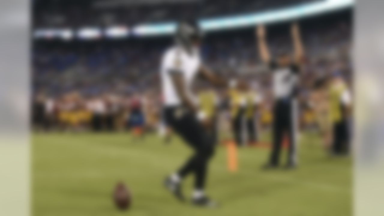 Baltimore Ravens quarterback Lamar Jackson (8) celebrates after rushing for a touchdown in the first half of a preseason NFL football game against the Washington Redskins, Thursday, Aug. 30, 2018, in Baltimore. (AP Photo/Gail Burton)