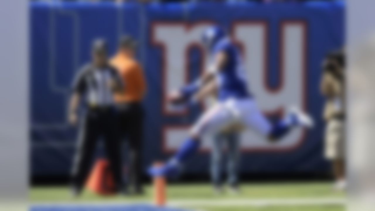 New York Giants running back Saquon Barkley scores a touchdown during the first half of an NFL football game against the Buffalo Bills, Sunday, Sept. 15, 2019, in East Rutherford, N.J. (AP Photo/Bill Kostroun)