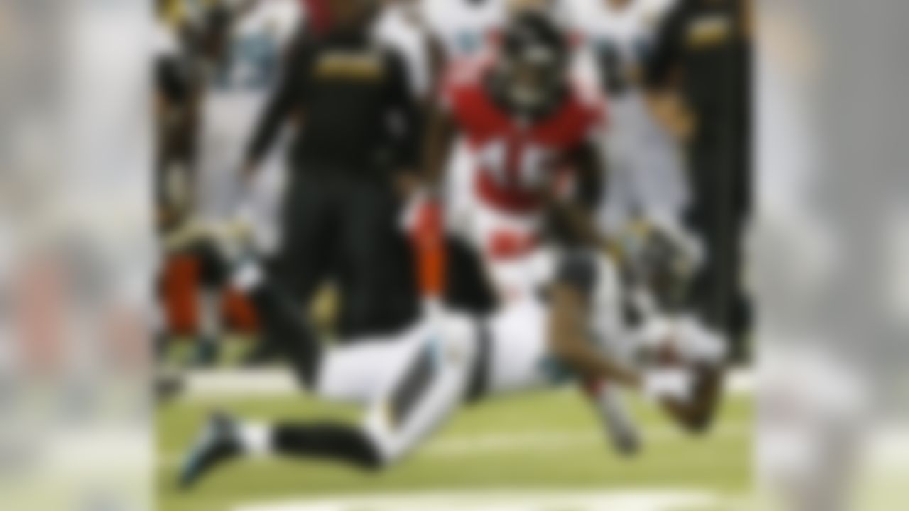 Jacksonville Jaguars running back Denard Robinson (16) falls to the turf as Atlanta Falcons outside linebacker Deion Jones (45) defends during the first half of a preseason NFL football game, Thursday, Sept. 1, 2016, in Atlanta. (AP Photo/John Bazemore)