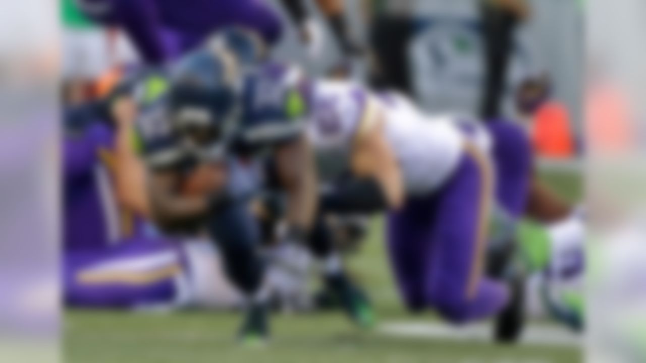 Seattle Seahawks running back Christine Michael (32) is tackled by Minnesota Vikings free safety Harrison Smith (22) during the first half of a preseason NFL football game Thursday, Aug. 18, 2016, in Seattle. (AP Photo/Elaine Thompson)