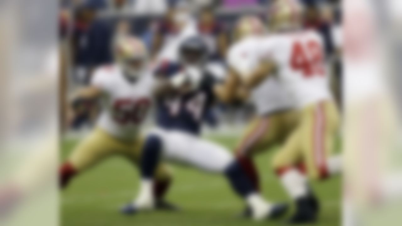 Houston Texans' Alfred Blue (44) is stopped by San Francisco 49ers' Chris Borland (50) as Craig Dahl (43) and Chase Thomas (48) close in during the first quarter of an NFL football preseason game Thursday, Aug. 28, 2014, in Houston. (AP Photo/David J. Phillip)