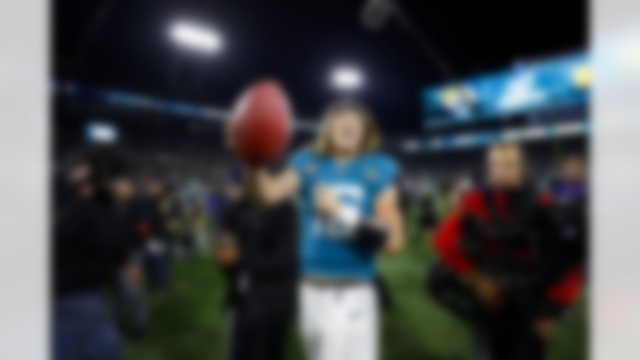 Jacksonville Jaguars quarterback Trevor Lawrence (16) celebrates after a last-second win of an NFL Super Wild Card Weekend playoff game against the Los Angeles Chargers on Saturday, January 14, 2023 in Jacksonville, Florida.