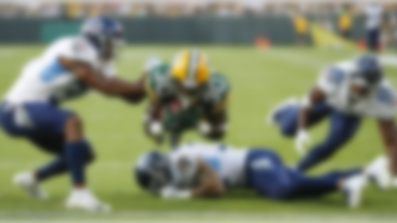 Green Bay Packers' Jamaal Williams dives into the end zone for a touchdown during the first half of a preseason NFL football game against the Tennessee Titans Thursday, Aug. 9, 2018, in Green Bay, Wis. (AP Photo/Matt Ludtke)