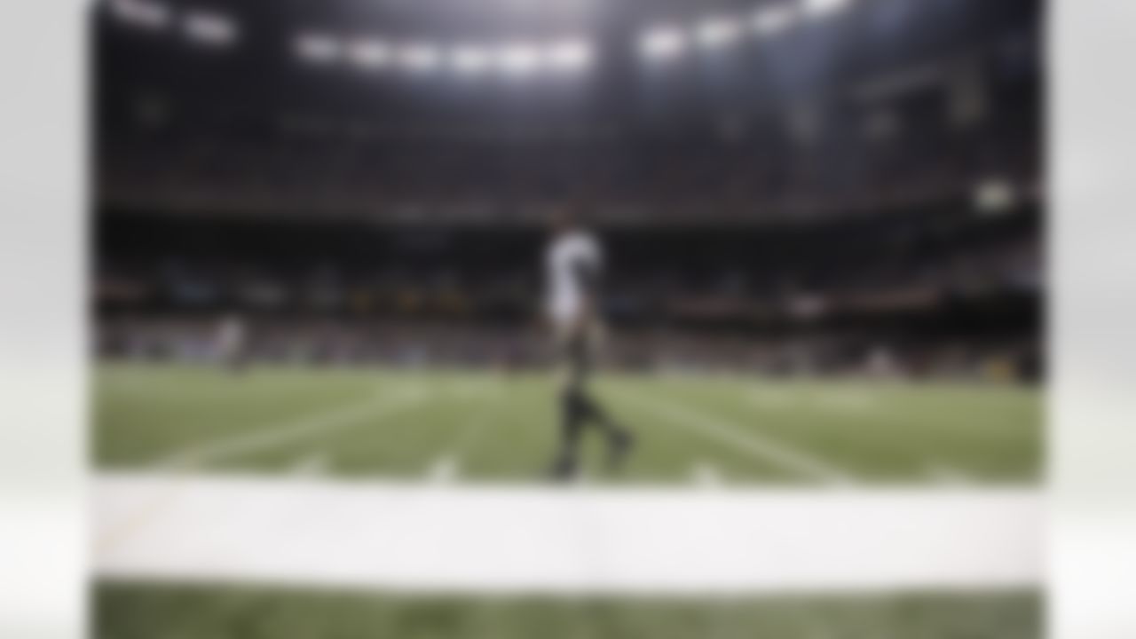 New Orleans Saints cornerback Champ Bailey (27) walks on the field before an NFL preseason football game against the Baltimore Ravens in New Orleans, Thursday, Aug. 28, 2014. (AP Photo/Bill Haber)