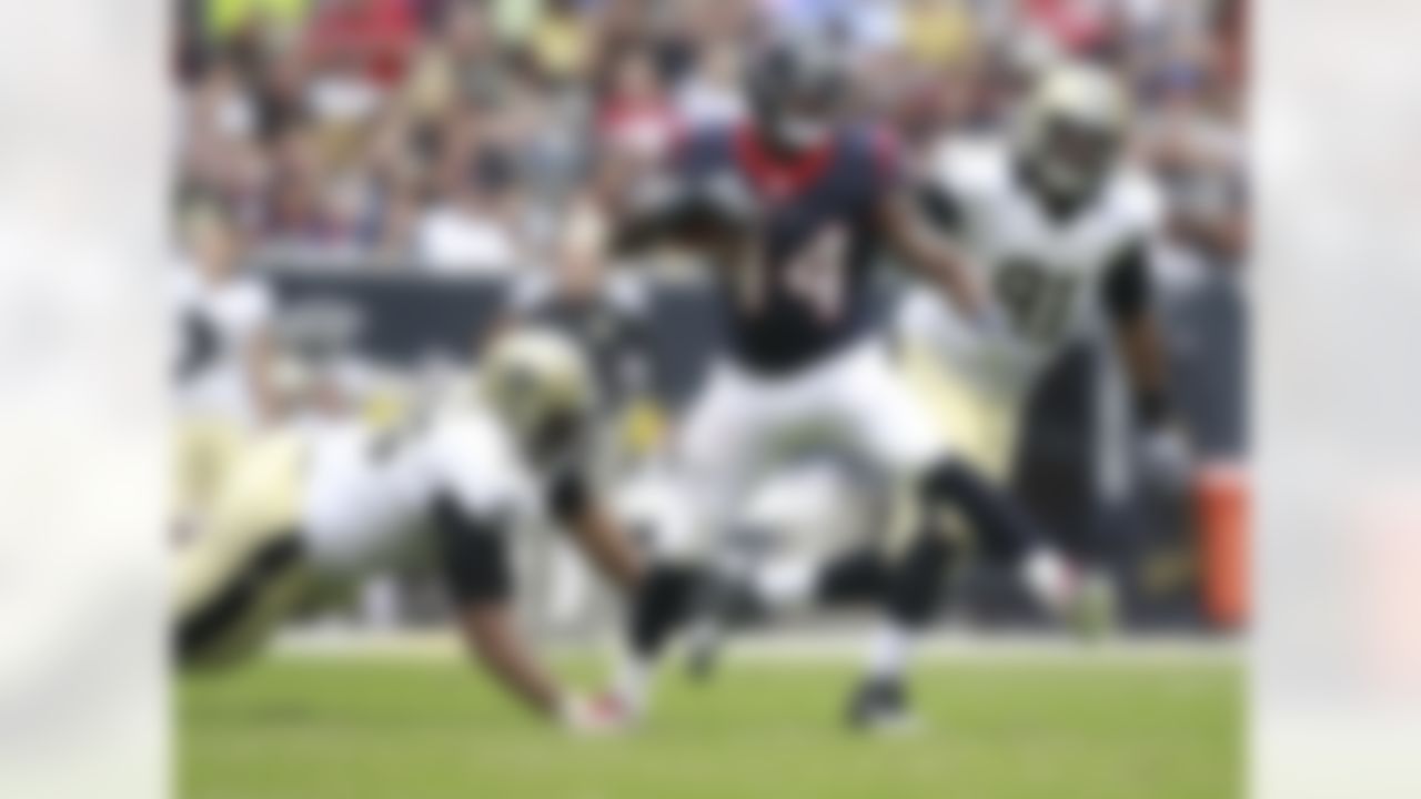 Houston Texans running back Ben Tate (44) maneuvers past New Orleans Saints defensive tackle Akiem Hicks (76) and Will Smith (91) during the first half of a preseason NFL football game Sunday, Aug. 25, 2013, in Houston. (AP Photo/Patric Schneider)