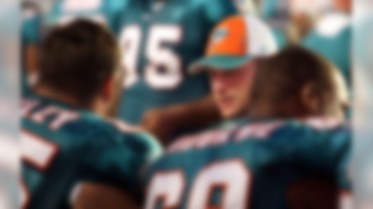 MIAMI - AUGUST 09: Quarterback Chad Pennington #10 of the Miami Dolphins chats with teammates during a pre season game against the Tampa Bay Buccaneers August 9, 2008 at Dolphin Stadium in Miami, Florida.  (Photo by Marc Serota/Getty Images)