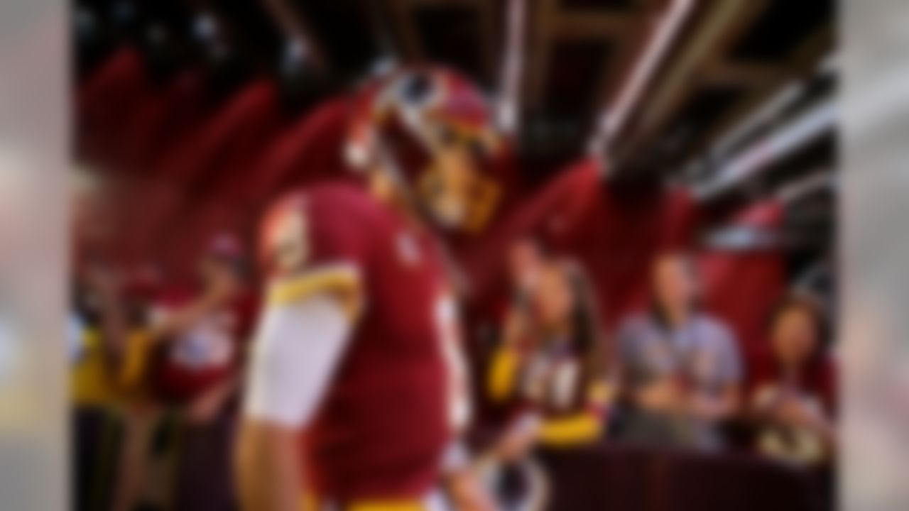 Washington Redskins quarterback Kirk Cousins walks out of a tunnel to the field before an NFL football game against the Philadelphia Eagles, Sunday, Sept. 10, 2017, in Landover, Md.