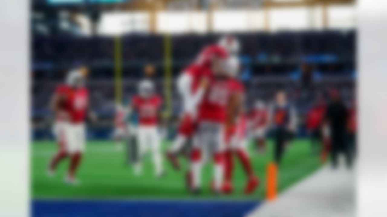 Arizona Cardinals offensive tackle Kelvin Beachum (68) celebrates with wide receiver Antoine Wesley (85) after he scored a touchdown during an NFL football game against the Dallas Cowboys on Sunday, January 2, 2022 in Arlington, Texas.