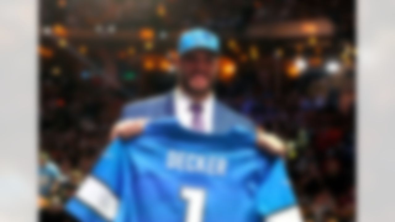 Ohio State offensive tackle Taylor Decker holds up his jersey after being drafted by the Detroit Lions during the 2016 NFL Draft at the Auditorium Theatre on Thursday, April 28, 2016 in Chicago. (Ben Liebenberg/NFL)