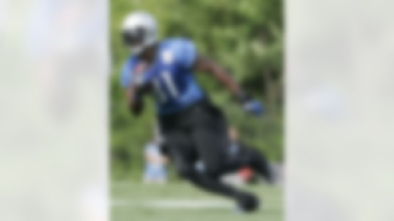 Detroit Lions wide receiver Calvin Johnson carries the ball during an NFL football training camp Saturday, July 28, 2012, in Allen Park, Mich. (AP Photo/Duane Burleson)
