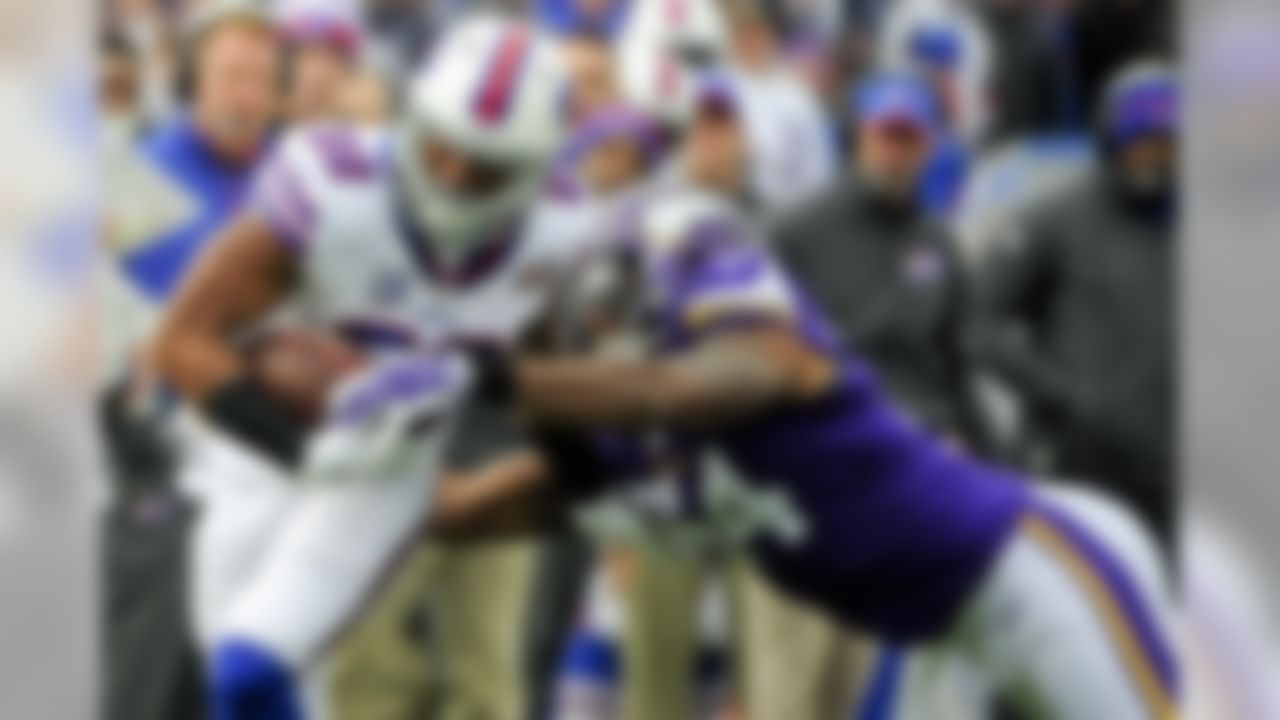 Minnesota Vikings middle linebacker Jasper Brinkley (54) strips the ball from Buffalo Bills' Fred Jackson (22) during the first half of an NFL football game Sunday, Oct. 19, 2014, in Orchard Park, N.Y. (AP Photo/Gary Wiepert)