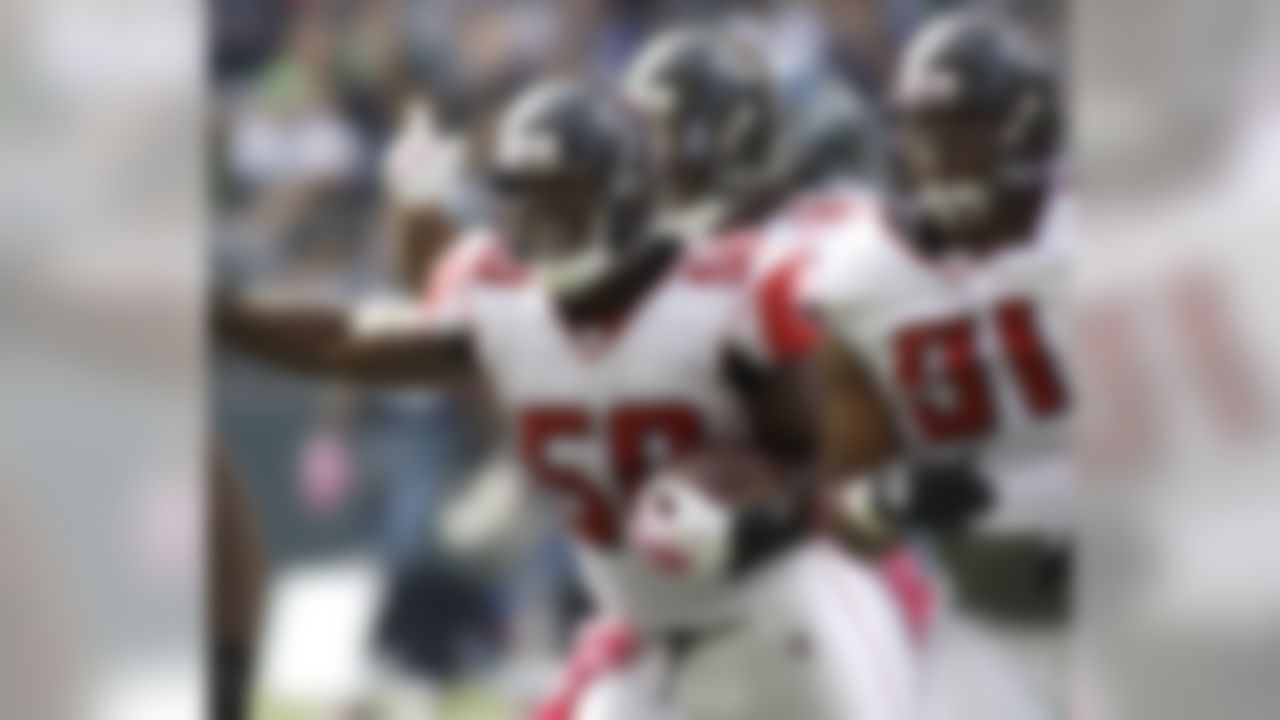 Atlanta Falcons' Curtis Lofton (50) celebrates his interception against the Seattle Seahawks along with Falcons' Corey Peters, right, in the first half of a NFL football game, Sunday, Oct. 2, 2011, in Seattle. (AP Photo/Ted S. Warren)