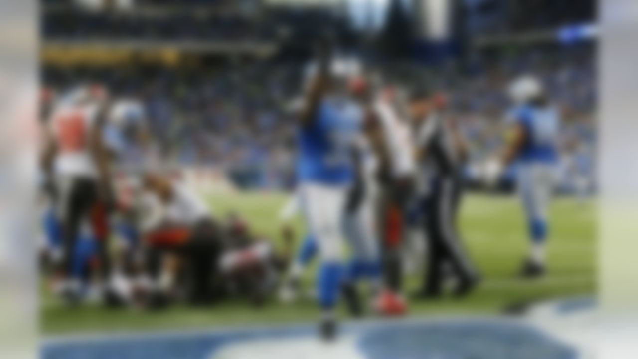 Detroit Lions running back Joique Bell (35) points to the crowd after his 1-yard touchdown run during the first half of an NFL football game against the Tampa Bay Buccaneers in Detroit, Sunday, Dec. 7, 2014. (AP Photo/Paul Sancya)