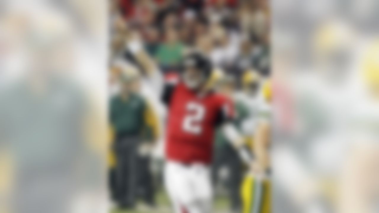 Atlanta Falcons quarterback Matt Ryan reacts after throwing a touchdown pass in the second quarter of an NFL football game against the Green Bay Packers in Atlanta, Sunday, Nov. 28, 2010. (AP Photo/John Bazemore)