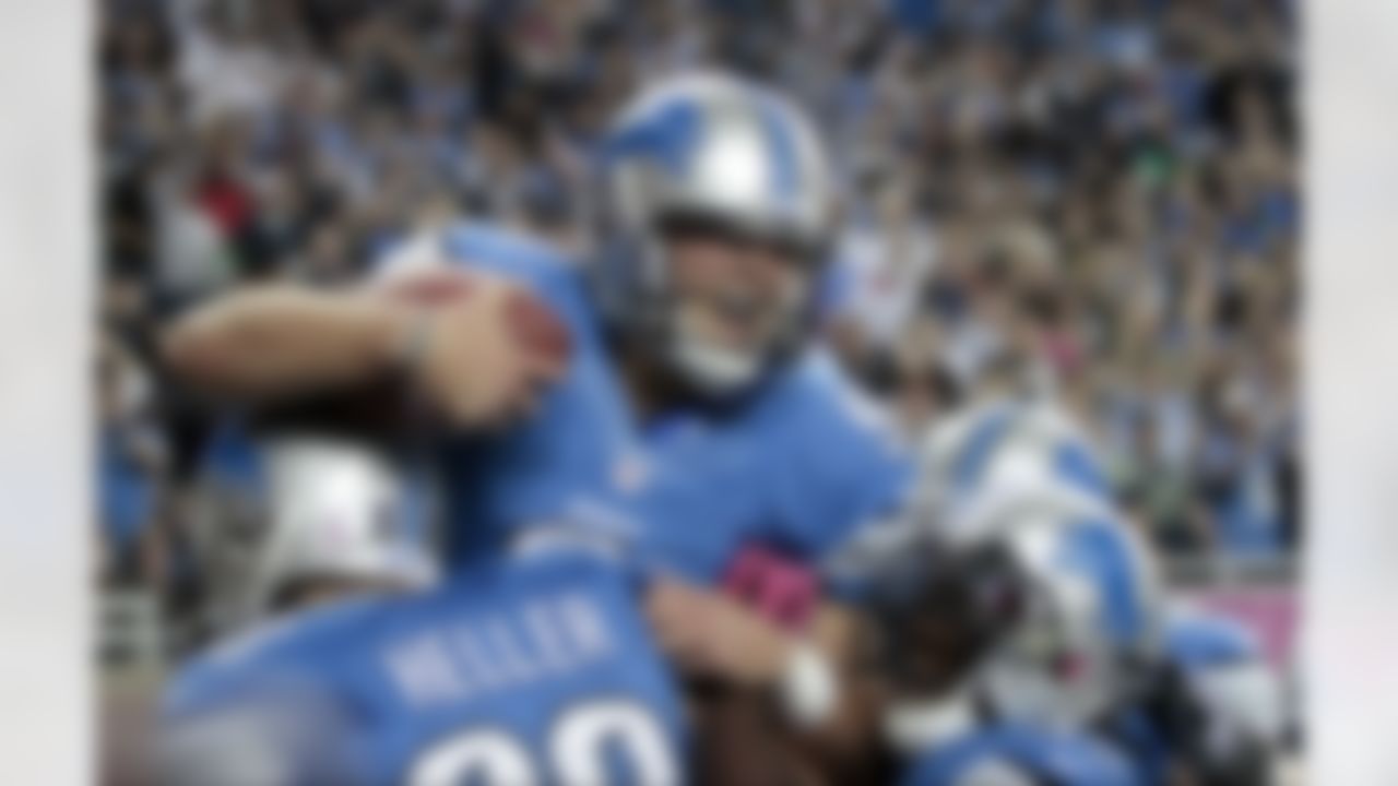 Detroit Lions quarterback Matthew Stafford (9) celebrates his touchdown run in the second half of an NFL football game against Seattle Seahawks, Sunday, Oct. 28, 2012, in Detroit. (AP Photo/Duane Burleson)
