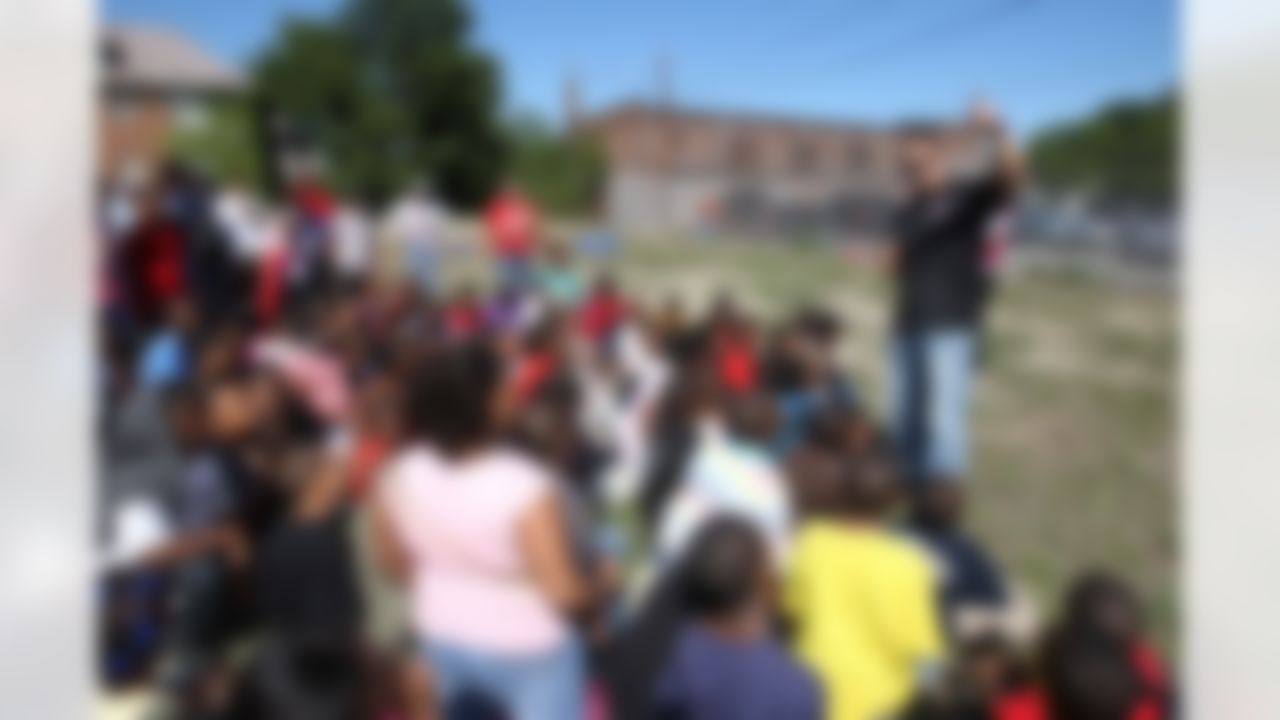 Mike Furrey talks to children from Joy Preparatory Academy about the importance of respect and giving back to the community. (Photo by Tom Copeland/Home Depot)