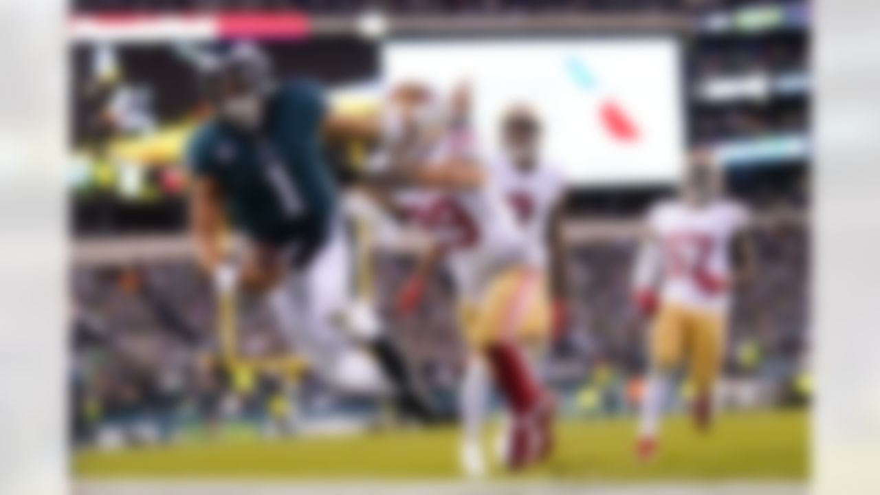 Philadelphia Eagles quarterback Jalen Hurts (1) is pushed out of bounds by San Francisco 49ers safety Talanoa Hufanga (29) during the second half of the NFC Championship NFL football game between the Philadelphia Eagles and the San Francisco 49ers on Sunday, Jan. 29, 2023, in Philadelphia.