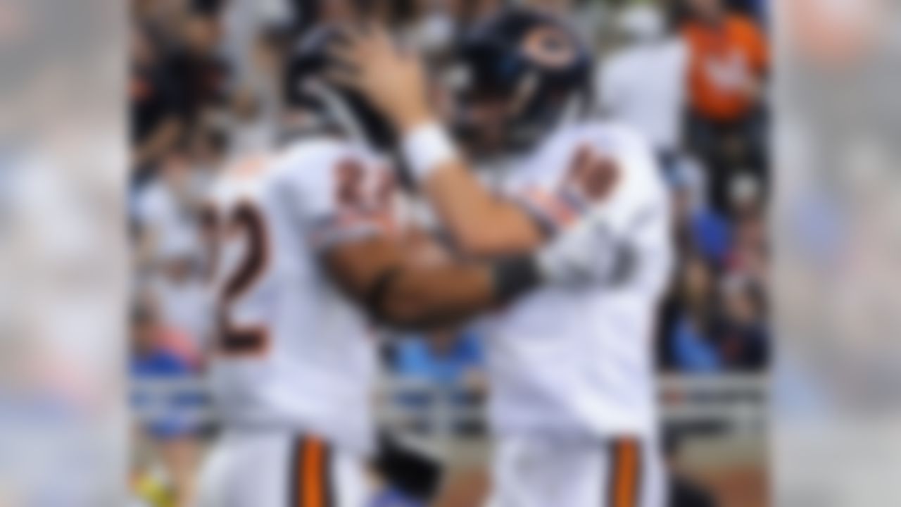 DETROIT - OCTOBER 05:  Kyle Orton #18 of the Chicago Bears celebrates his touchdown pass to Matt Forte #22 against the Detroit Lions for a 10-0 lead during the aecond quarter at Ford Field on October 5, 2008 in Detroit, Michigan.  (Photo by Harry How/Getty Images)