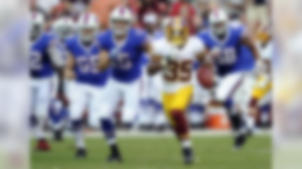 Washington Redskins running back Chris Thompson (35) rushes the ball past Buffalo Bills defenders in the second half of an NFL preseason football game Saturday, Aug. 24, 2013, in Landover, Md. (AP Photo/Nick Wass)