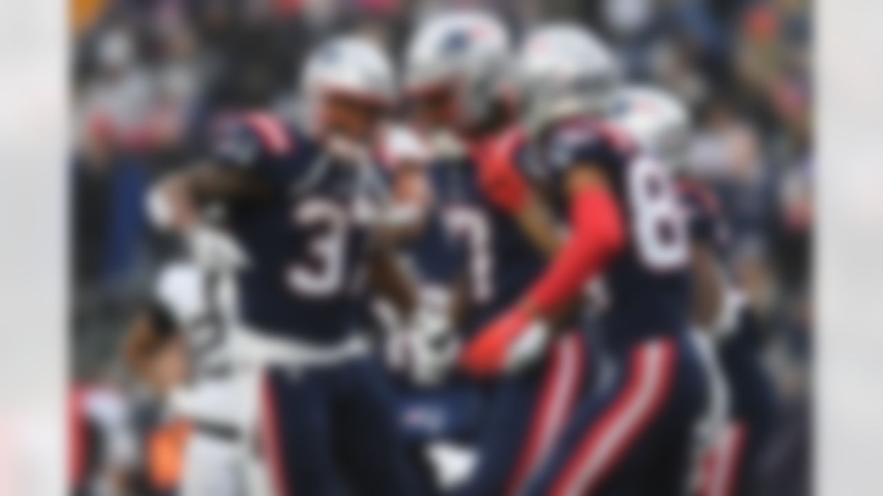 New England Patriots wide receiver Kristian Wilkerson (17) scores a touchdown and celebrates with running back Damien Harris (37) during an NFL football game against the Jacksonville Jaguars on Sunday, January 2, 2022 in Foxborough, Massachusetts.