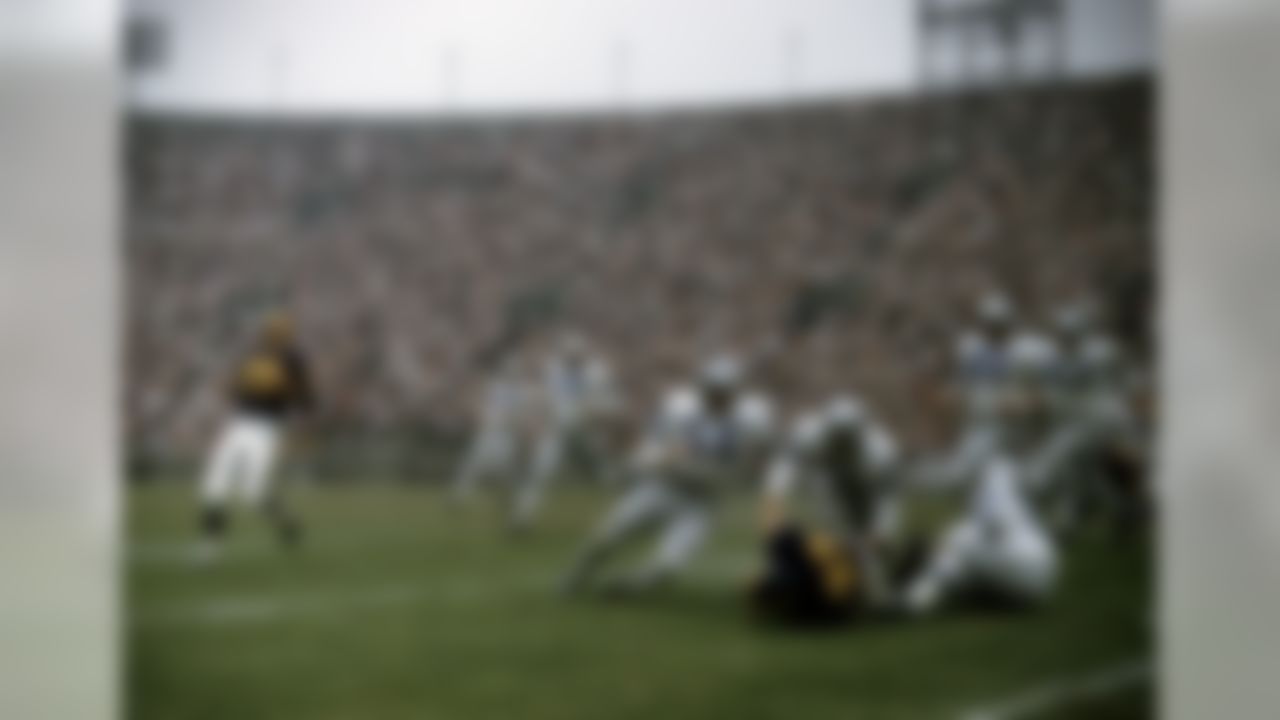 Hall of Fame defensive back Yale Lary (28) of the Detroit Lions stops Rams Hall of Fame running back Ollie Matson (33) during the Lions 17-7 victory over the Los Angeles Rams on October 25, 1959 at the Los Angeles Memorial Coliseum in Los Angeles. (National Football League)