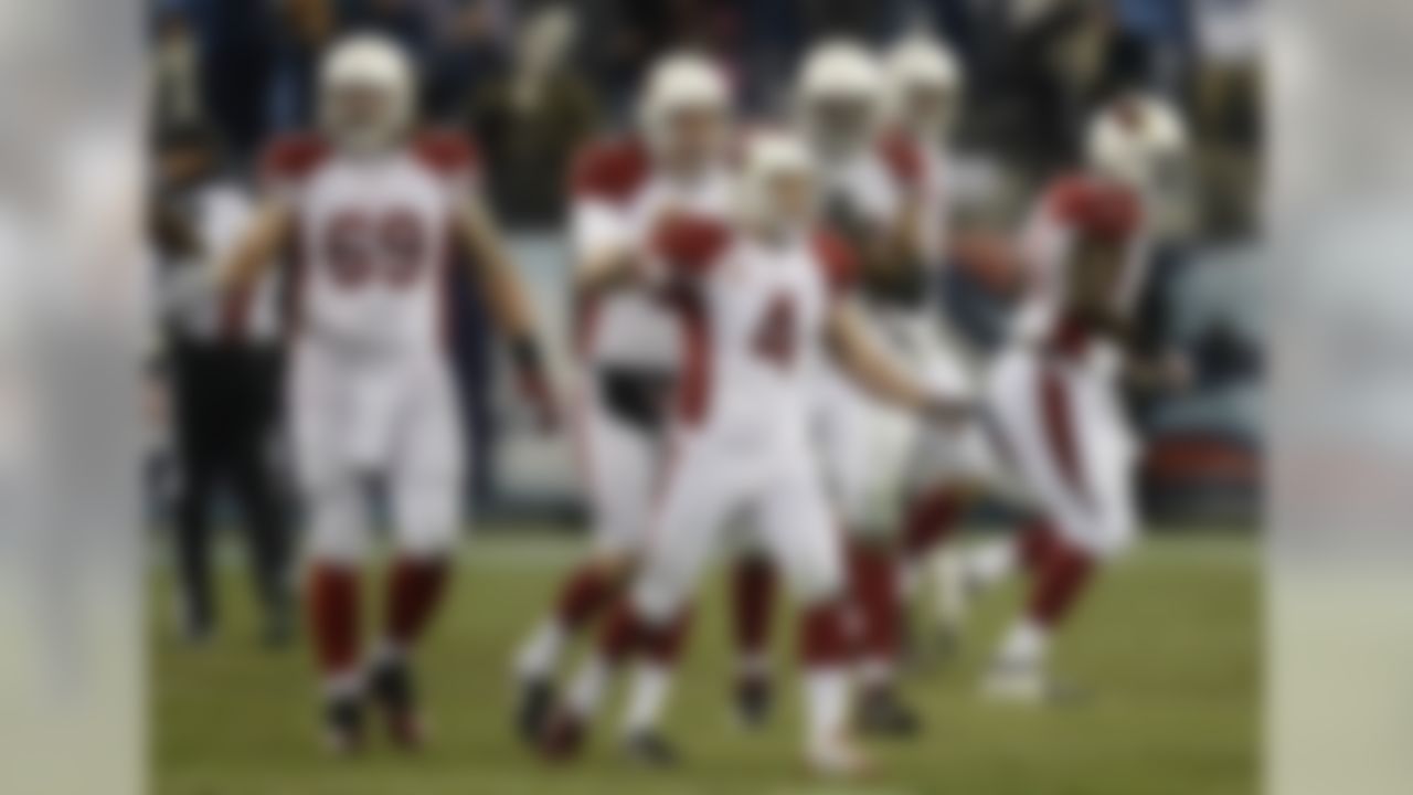 Arizona Cardinals kicker Jay Feely (4) is congratulated after kicking a 41-yard field goal in overtime against the Tennessee Titans to give the Cardinals a 37-34 win in an NFL football game Sunday, Dec. 15, 2013, in Nashville, Tenn. (AP Photo/Mark Zaleski)