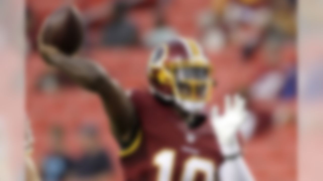 Washington Redskins quarterback Robert Griffin III warms up before an NFL preseason football game against the Detroit Lions, Thursday, Aug. 20, 2015, in Landover, Md. (AP Photo/Mark Tenally)