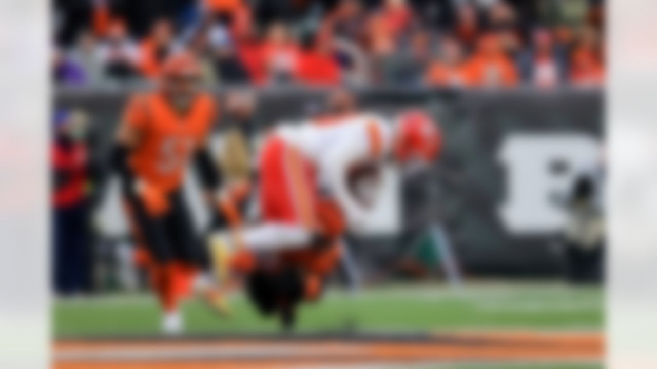 Kansas City Chiefs wide receiver Tyreek Hill (10) is tackled by Cincinnati Bengals cornerback Mike Hilton (21) during an NFL football game on Sunday, January 2, 2022 in Cincinnati, Ohio.