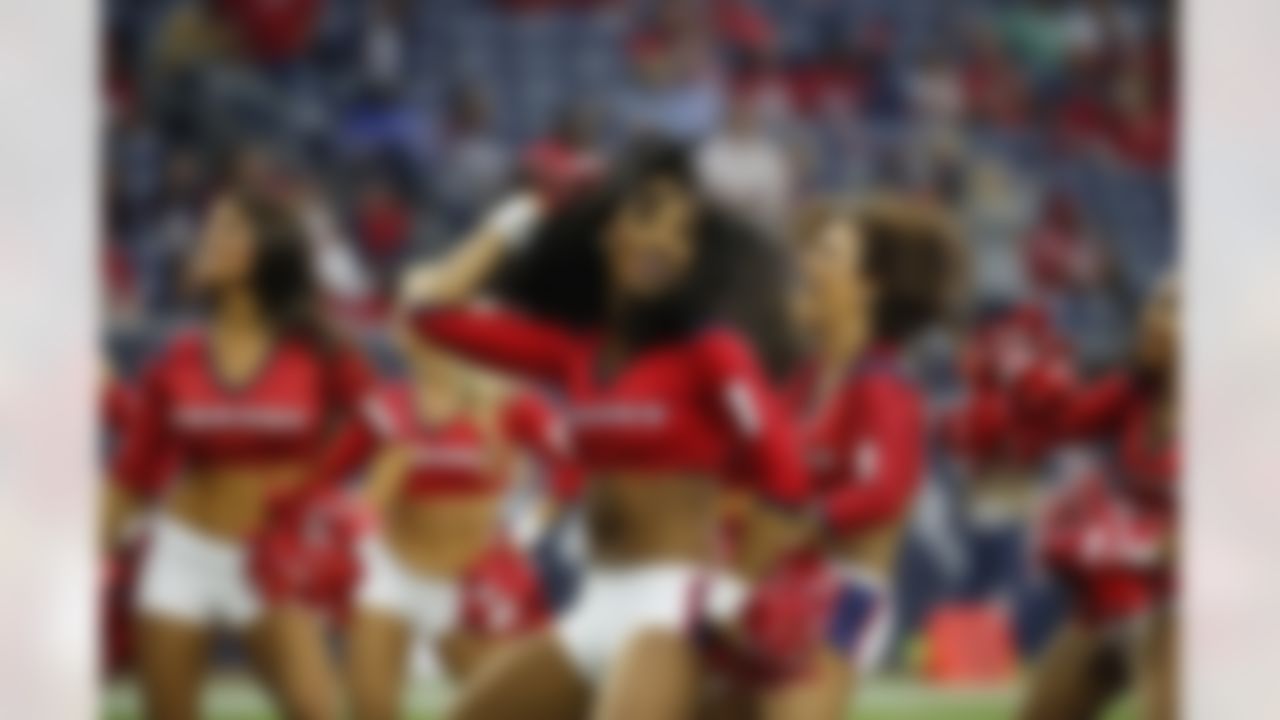 The Houston Texans cheerleaders perform during the fourth quarter of an NFL football game, Sunday, Nov. 2, 2014, in Houston. (AP Photo/Tony Gutierrez)