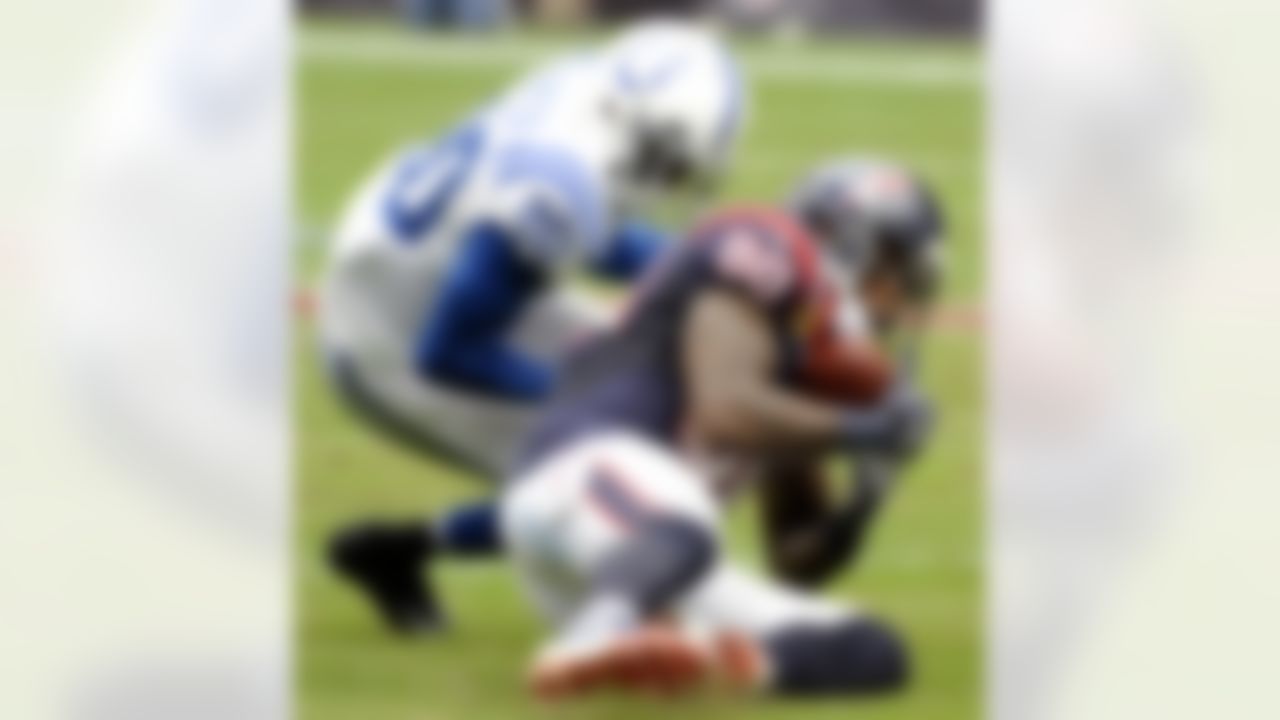 Houston Texans wide receiver Andre Johnson (80) catches a pass as Indianapolis Colts cornerback Darius Butler (20) defends in the second quarter of an NFL football game on Sunday, Dec. 16, 2012, in Houston. (AP Photo/Dave Einsel)