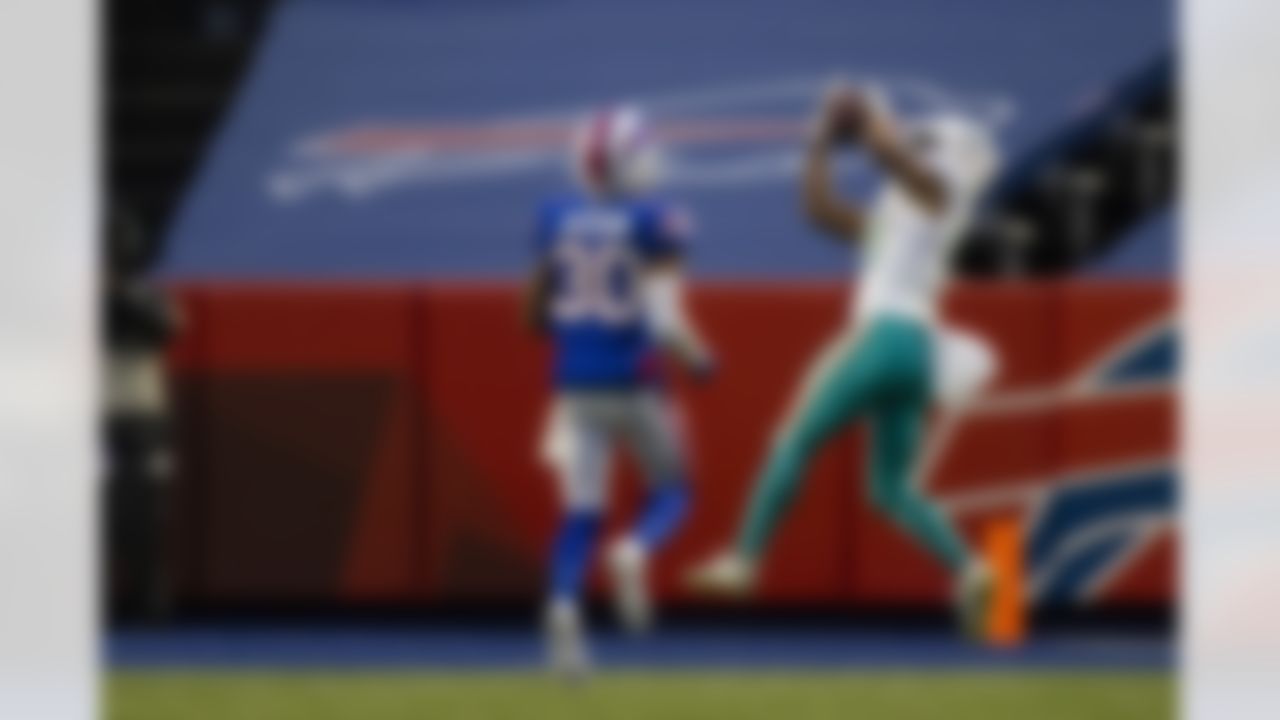 Miami Dolphins running back Malcolm Perry (10) makes a touchdown reception against the Buffalo Bills during the fourth quarter of an NFL football game, Sunday, Jan. 3, 2021, in Orchard Park, N.Y.