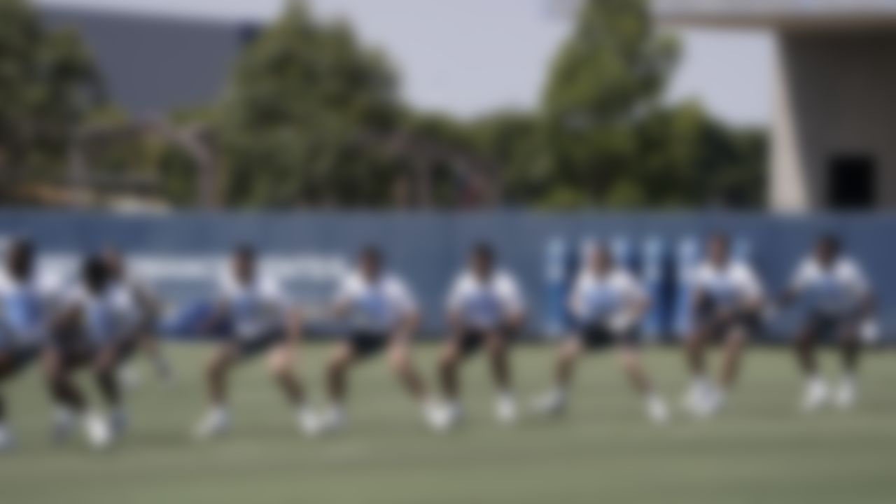 Los Angeles Chargers players warm up during an NFL football rookie minicamp in Costa Mesa, Calif., Friday, May 14, 2021.