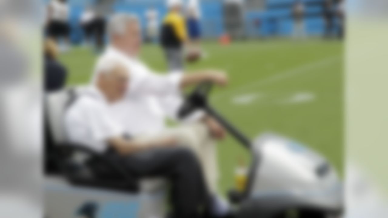 Carolina Panthers owner Jerry Richardson, back, and Pittsburgh Steelers chairman Dan Rooney, front, look on as their teams warm up before an NFL preseason football game in Charlotte, N.C., Thursday, Aug. 29, 2013. (AP Photo/Bob Leverone)
