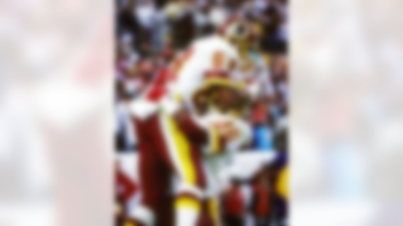 Washington Redskins wide receiver Ricky Sanders (83) jumps into the arms of running back Timmy Smith (36) after Sanders scored one of his two touchdowns during Super Bowl XXII, a 42-10 victory over the Denver Broncos on January 31, 1988, at Jack Murphy Stadium. (National Football League)
