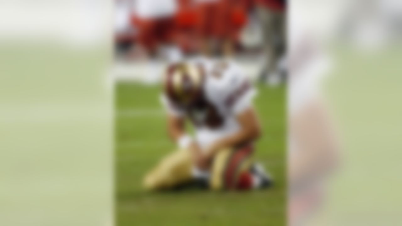 GLENDALE, AZ - NOVEMBER 10:  Quarterback Shaun Hill #13 of the San Francisco 49ers drops to his knees in reaction to throwing an interception to the Arizona Cardinals during the fourth quarter at University of Phoenix Stadium on November, 10 2008 in Glendale, Arizona.  The Cardinals won 29-24.   (Photo by Harry How/Getty Images)