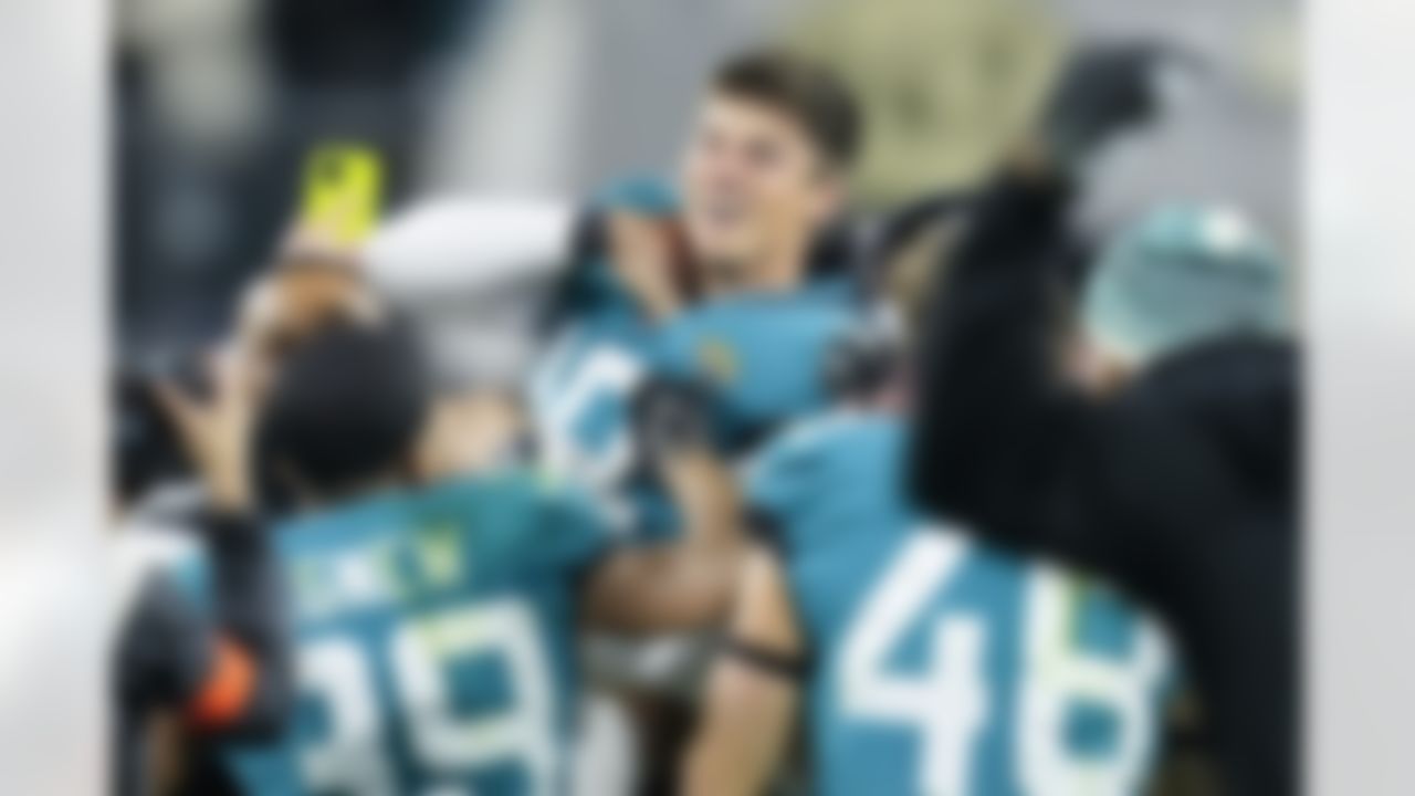 Jacksonville Jaguars place kicker Riley Patterson (10) and his team celebrate his game-winning field goal against the Los Angeles Chargers during the second half of an NFL wild-card football game, Saturday, Jan. 14, 2023, in Jacksonville, Fla. Jacksonville Jaguars won 31-30.