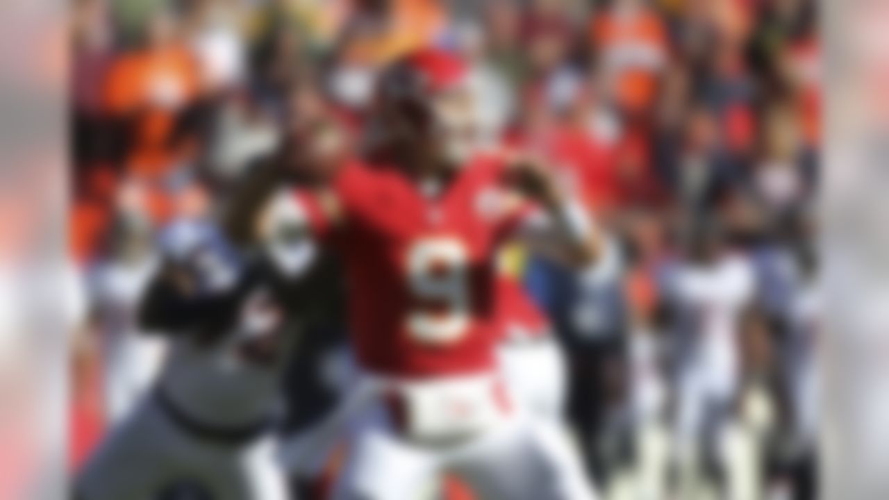 Kansas City Chiefs quarterback Brady Quinn (9) passes to a teammate during the first half of an NFL football game against the Denver Broncos at Arrowhead Stadium in Kansas City, Mo., Sunday, Nov. 25, 2012. (AP Photo/Ed Zurga)