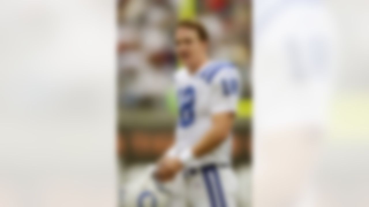 PHILADELPHIA - NOVEMBER 10: Quarterback Peyton Manning #18 of the Indianapolis Colts looks on after the Colts went up 14-3 against the Philadelphia Eagles at Veterans Stadium on November 10, 2002 in Philadelphia, Pennsylvania. The Colts defeated the Eagles 35-13. (Photo by Ezra Shaw/Getty Images)