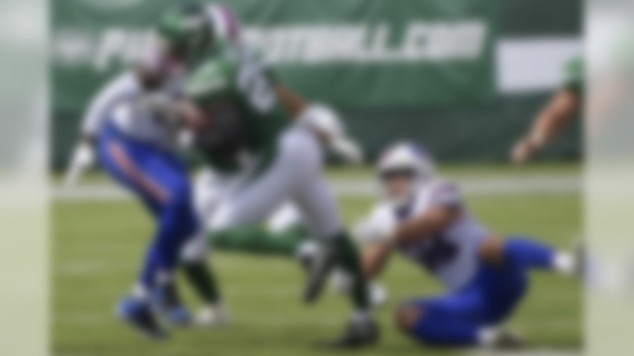 New York Jets' Le'Veon Bell (26) breaks a tackle by Buffalo Bills' Matt Milano (58) during the first half of an NFL football game Sunday, Sept. 8, 2019, in East Rutherford, N.J. (AP Photo/Bill Kostroun)