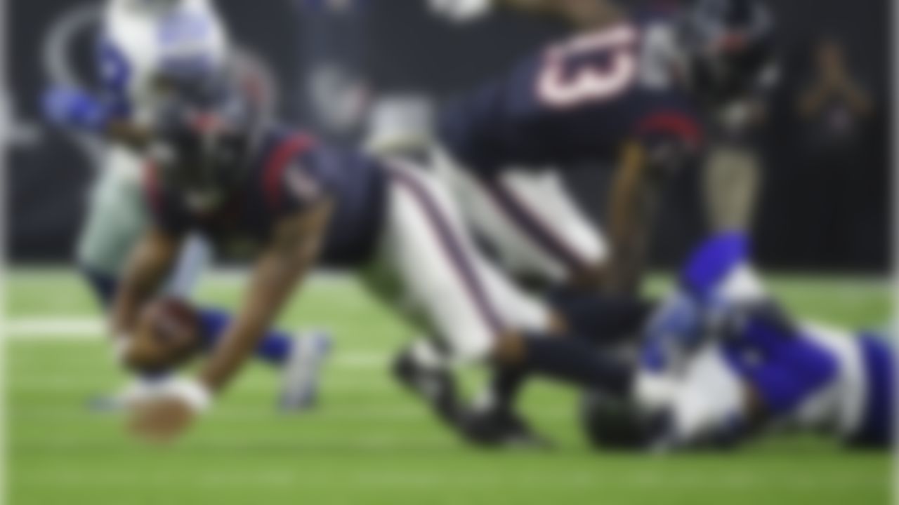 Houston Texans quarterback Joe Webb (5) is dropped by Dallas Cowboys tight end Blake Jarwin, right, during the first half of a preseason NFL football game Thursday, Aug. 30, 2018, in Houston. (AP Photo/Eric Christian Smith)
