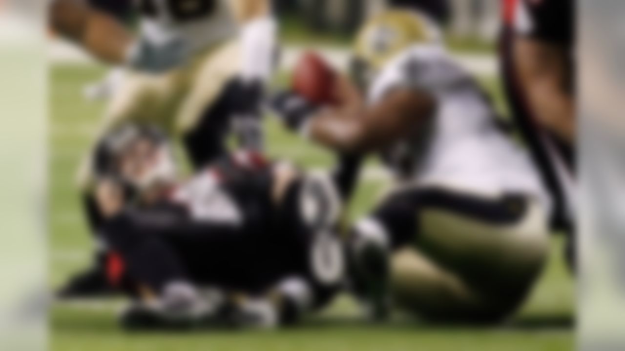 ATLANTA - DECEMBER 10: Will Smith #91 of the New Orleans Saints causes a fumble during a sack of quarterback Chris Redman #8 of the Atlanta Falcons on December 10, 2007 at the Georgia Dome in Atlanta, Georgia. The Saints defeated the Falcons 34-14. (Photo by Chris Graythen/Getty Images)