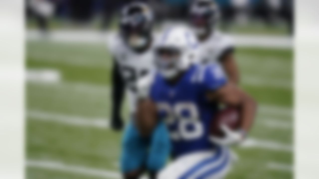 Indianapolis Colts' Jonathan Taylor (28) runs for a touchdown during the second half of an NFL football game against the Jacksonville Jaguars, Sunday, Jan. 3, 2021, in Indianapolis.