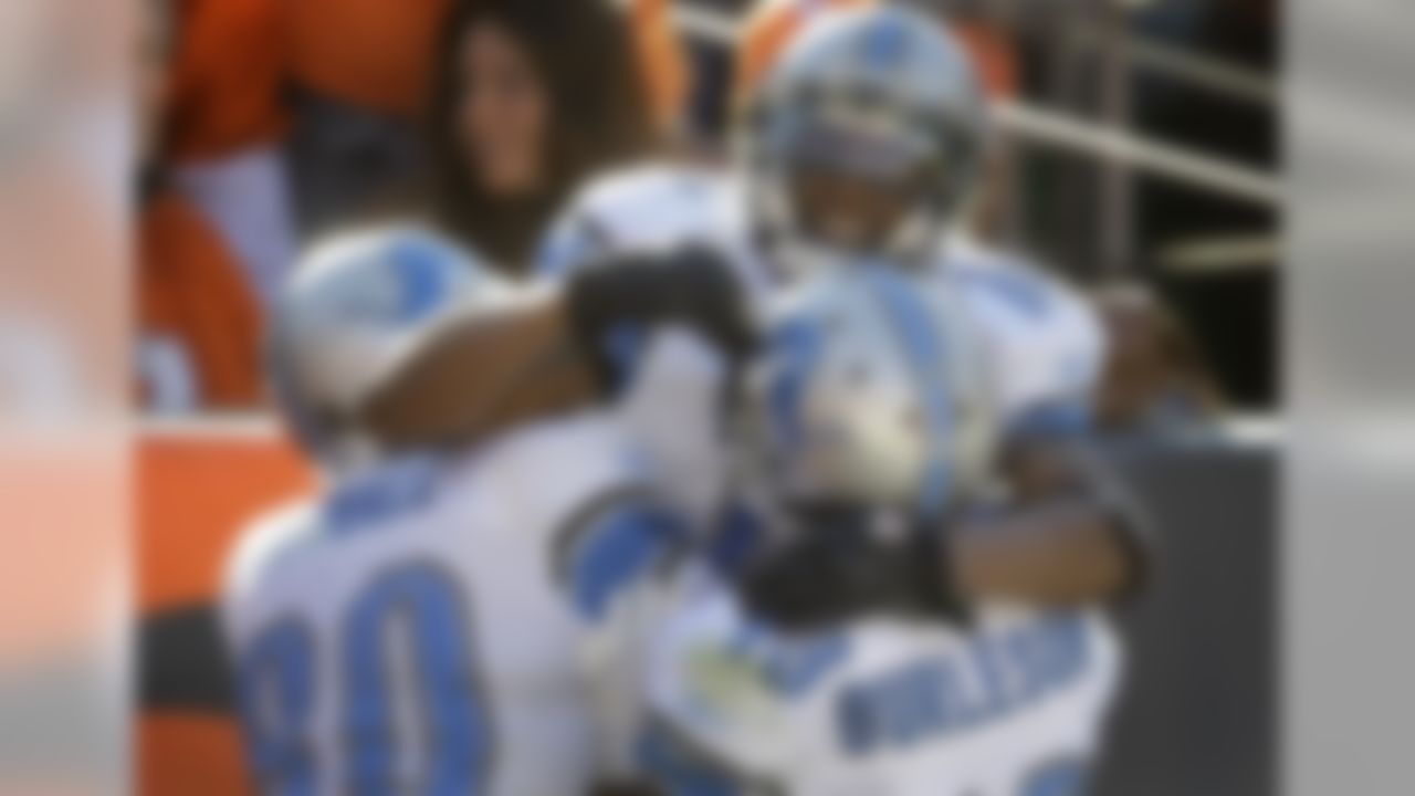 Detroit Lions wide receiver Titus Young (16) celebrates with Lions wide receivers Maurice Stovall (80) and Nate Burleson (13) after catching a pass for a touchdown against the Denver Broncos in the first quarter of an NFL football game on Sunday, Oct. 30, 2011, in Denver.  (AP Photo/Joe Mahoney)