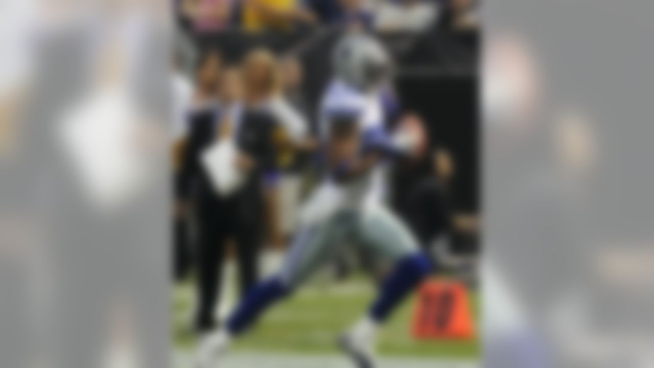 Dallas Cowboys cornerback Alan Ball returns a blocked field goal for a touchdown during the first half of an NFL preseason football game against the Minnesota Vikings, Saturday, Aug. 27, 2011, in Minneapolis. (AP Photo/Jim Mone)