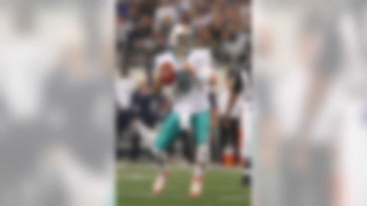 Nov 24, 2011; Arlington, TX, USA; Miami Dolphins quarterback Matt Moore (8) throws in the pocket against the Dallas Cowboys on Thanksgiving day at Cowboys Stadium.  Mandatory Credit: Matthew Emmons-US PRESSWIRE
