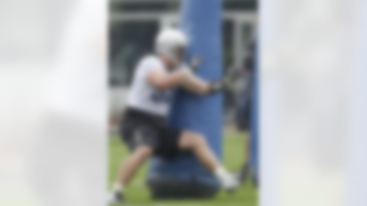 Detroit Lions defensive end Kyle Vanden Bosch runs through blocking dummies during drills at NFL football training camp in Allen Park, Mich., Wednesday, Aug. 3, 2011. (AP Photo/Carlos Osorio)