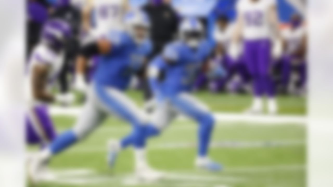 Detroit Lions running back D'Andre Swift (32) rushes behind blocker offensive guard Jonah Jackson (73) in the second half against the Minnesota Vikings during an NFL football game, Saturday, Jan. 3, 2021, in Detroit.